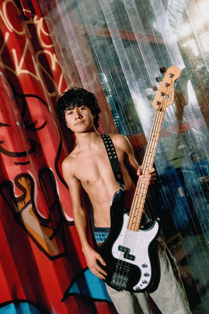 XCOMM bassist portrait, by Maya Sacks